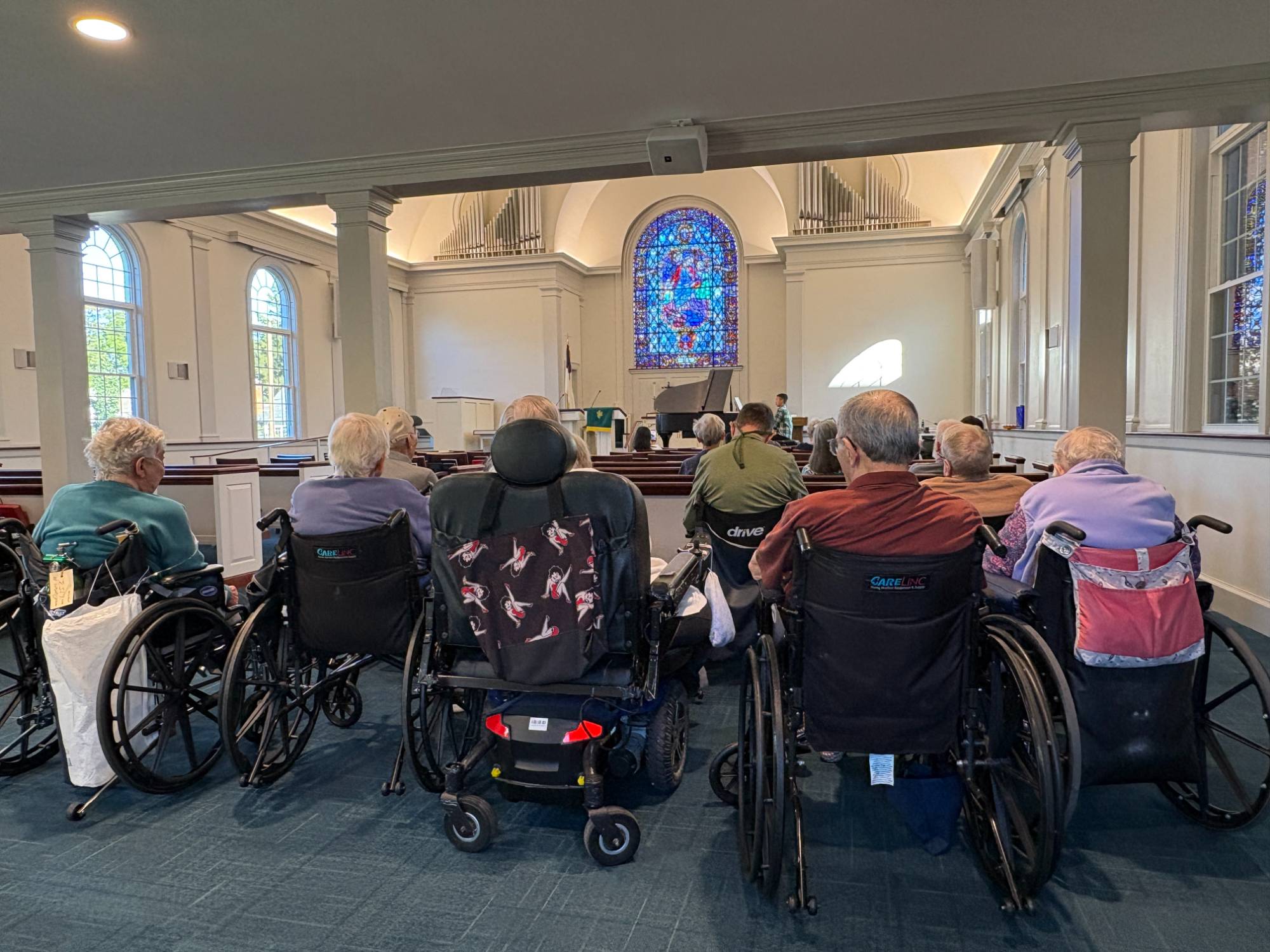 Residents listening to the music in the church